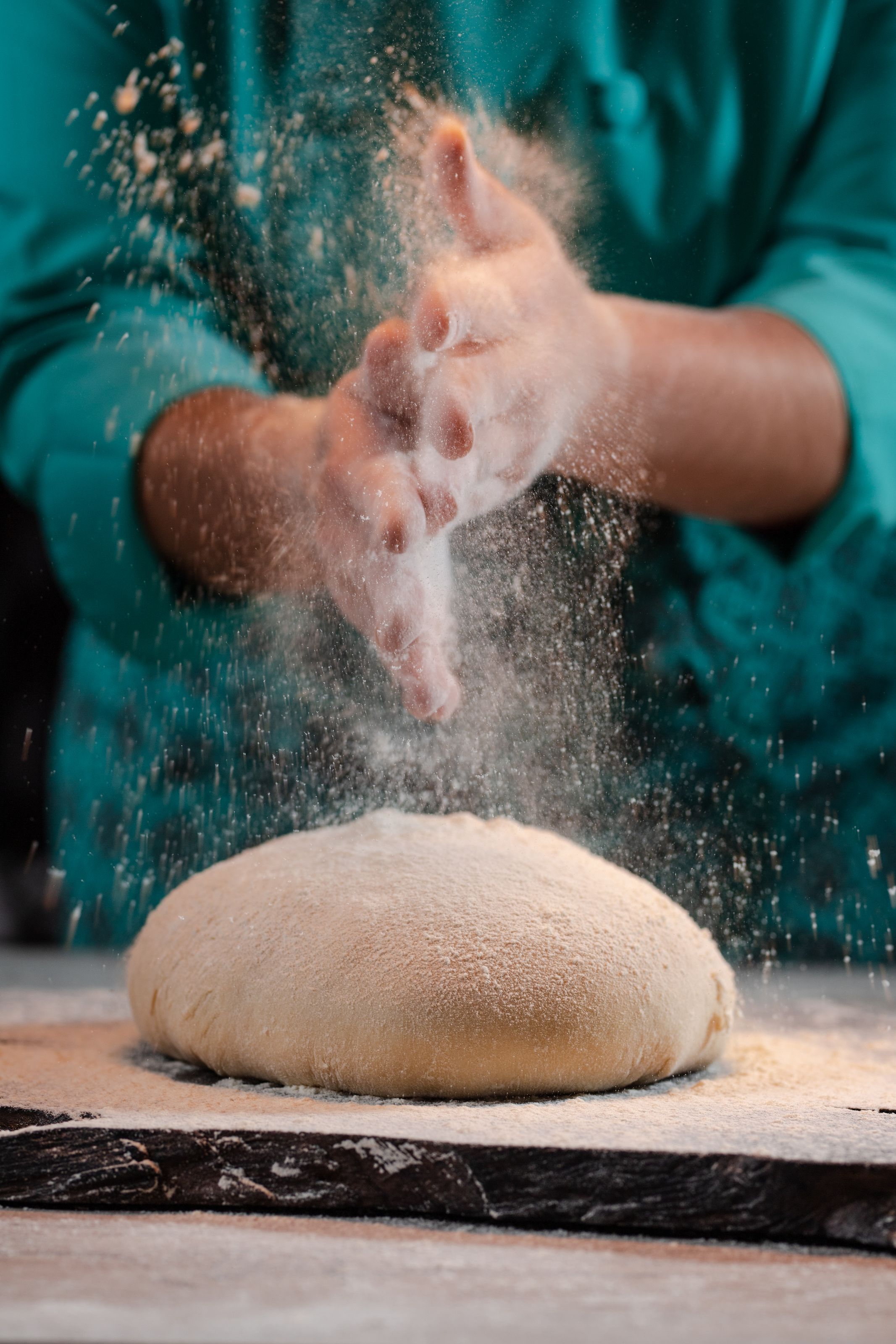 Juna at the bench, shaping dough