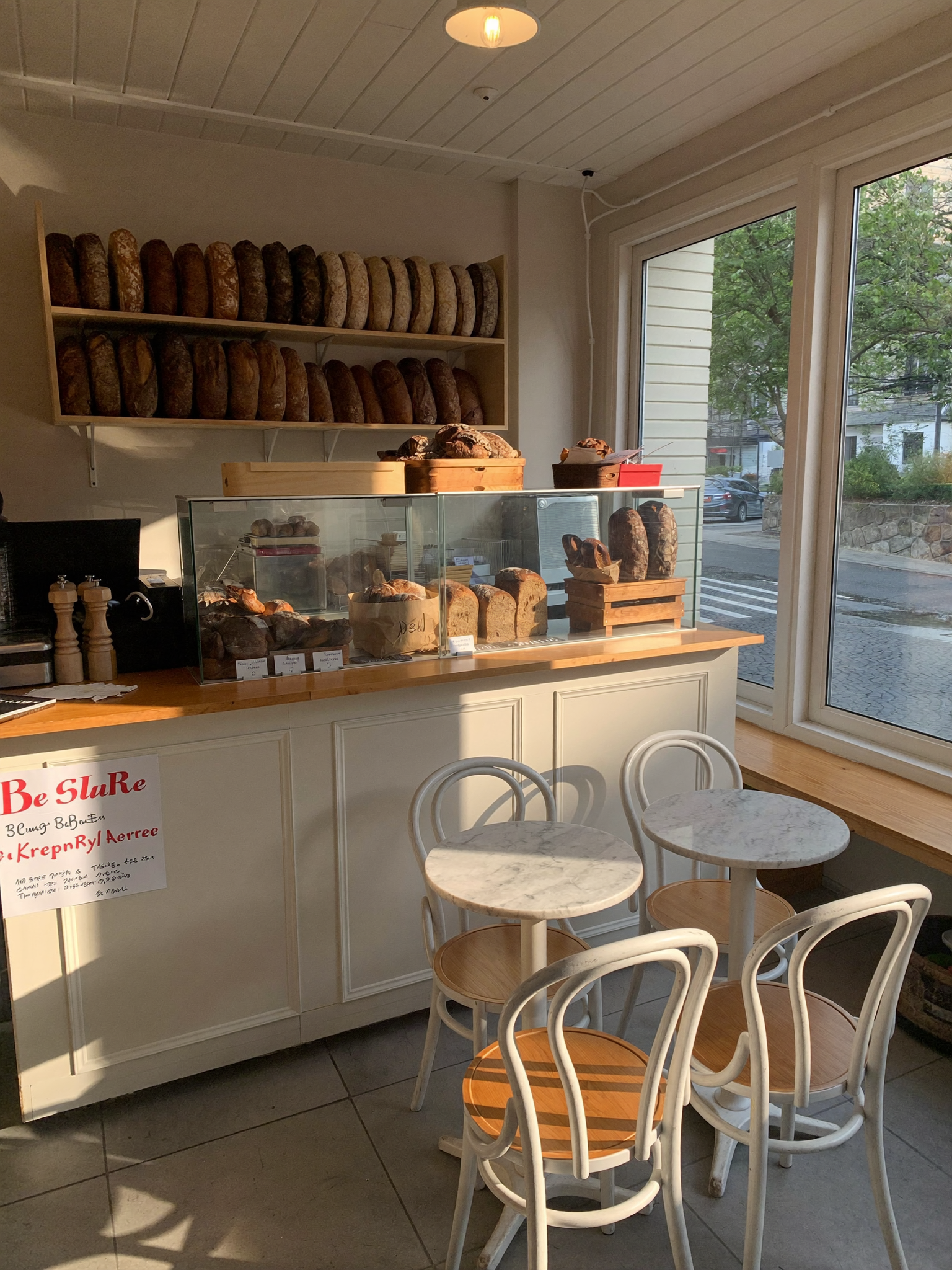 Inside Juna Bakes — the counter, the shelves, the light in the morning